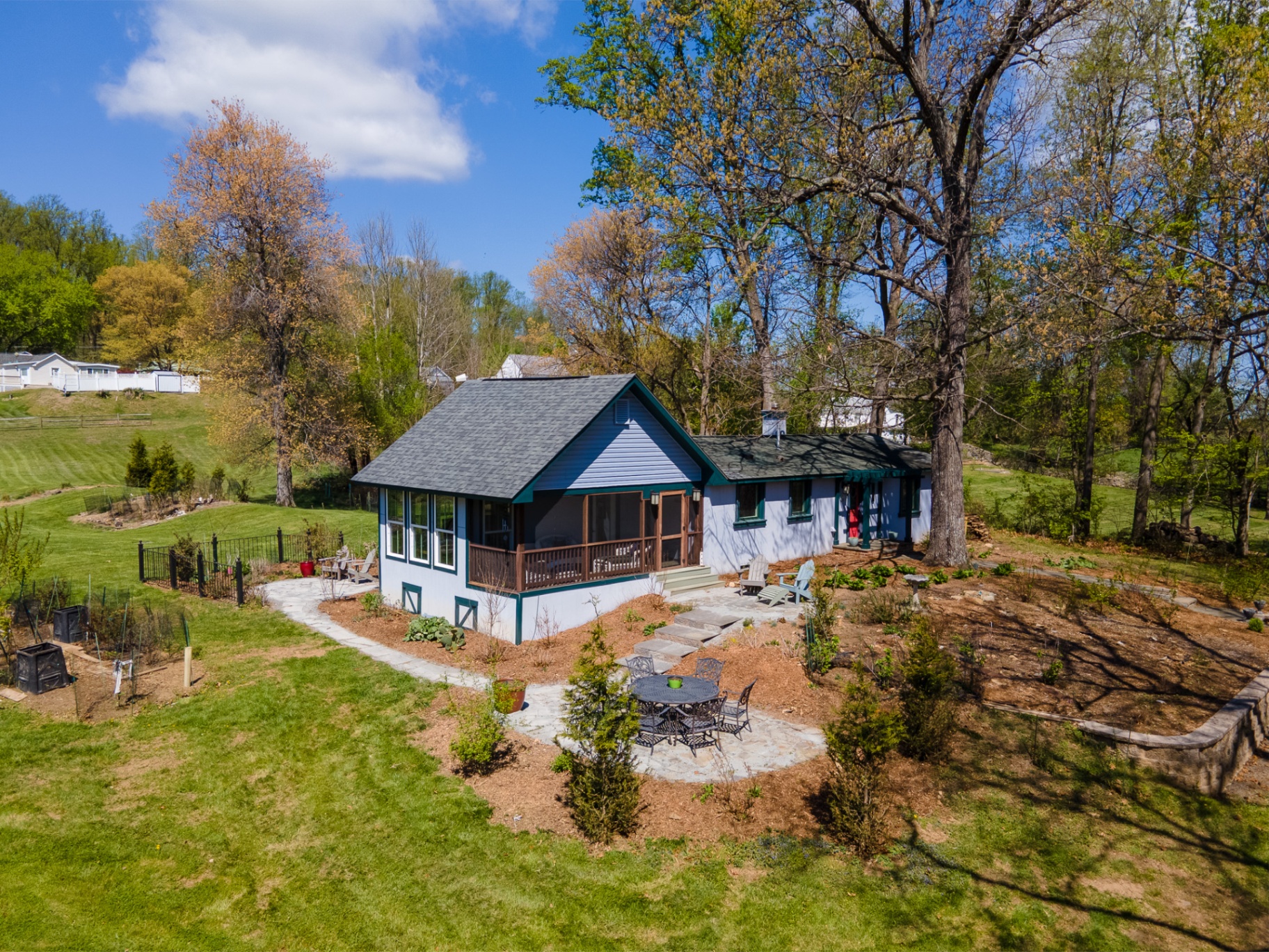 2681 Halfway Road — second residence with screened porch, flagstone patio, and garden views