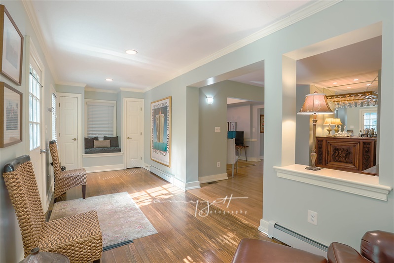 Entry hall with built-in window seat and dining vista
